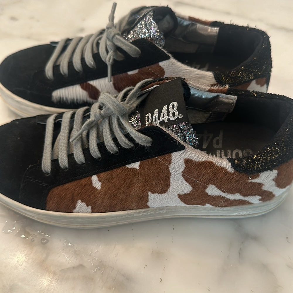 P448 Black and cow print. Grey shoelaces and silver sparkles.